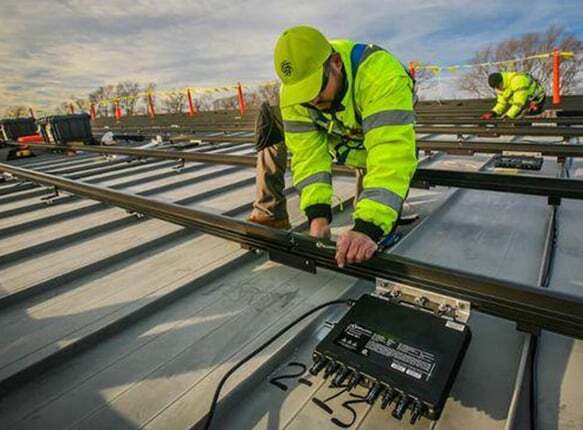 Man installing microinverter