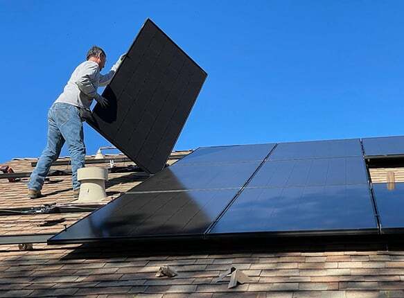 Man installing solar panels