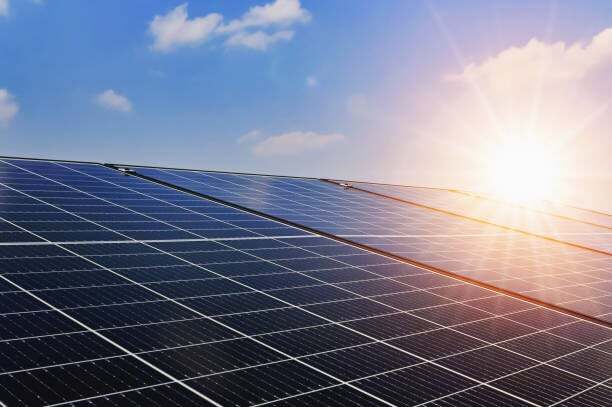 Solar panels with sunset and blue sky background Clean power energy concept