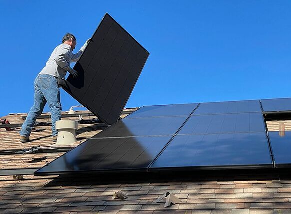 Man installing solar panels